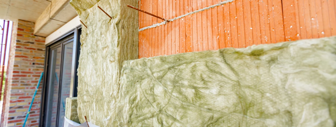 isoler mur en pierre enduit au ciment