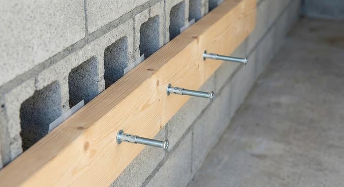 percer mur parpaing garage fixations