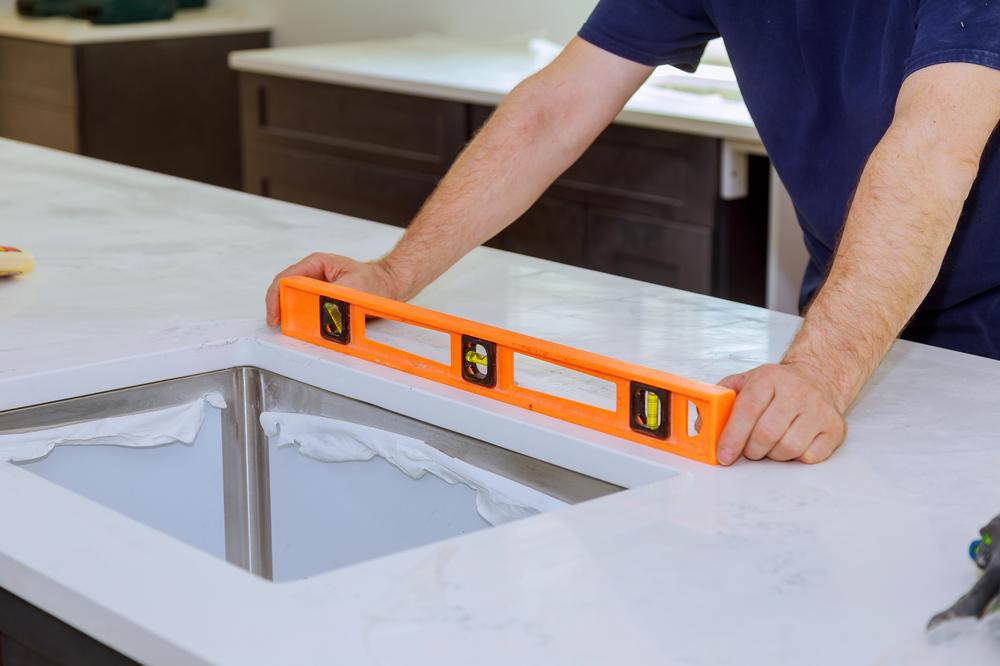 meuble angle cuisine mise niveau reglage pieds